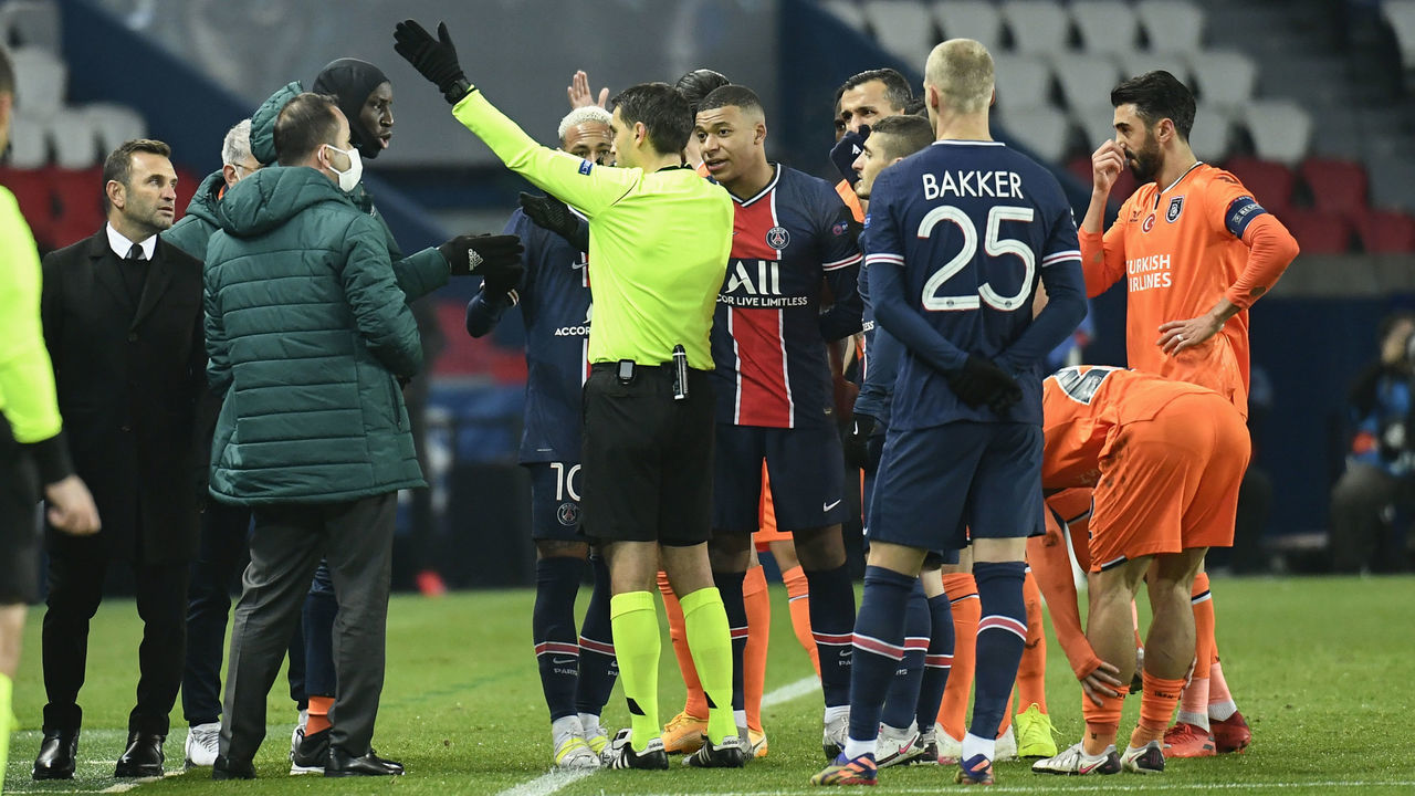 PARIS, FRANCE - DECEMBER 8: Head coach of Medipol Basaksehir Okan Buruk (2nd L) and players are seen as Paris Saint Germain and Medipol Basaksehir UEFA Champions League match paused after Basaksehir head to locker room for alleged racist remarks by 4th official to assistant manager Webo at the Princes Park, in Paris, France on December 8, 2020.