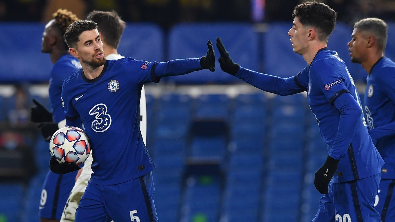 Chelsea's Italian midfielder Jorginho (L) celebrates with Chelsea's German midfielder Kai Havertz after scoring from the penalty spot to score his team's equalising goal during the UEFA Champions League Group E football match between Chelsea and FK Krasnodar at Stamford Bridge in London on December 8, 2020.