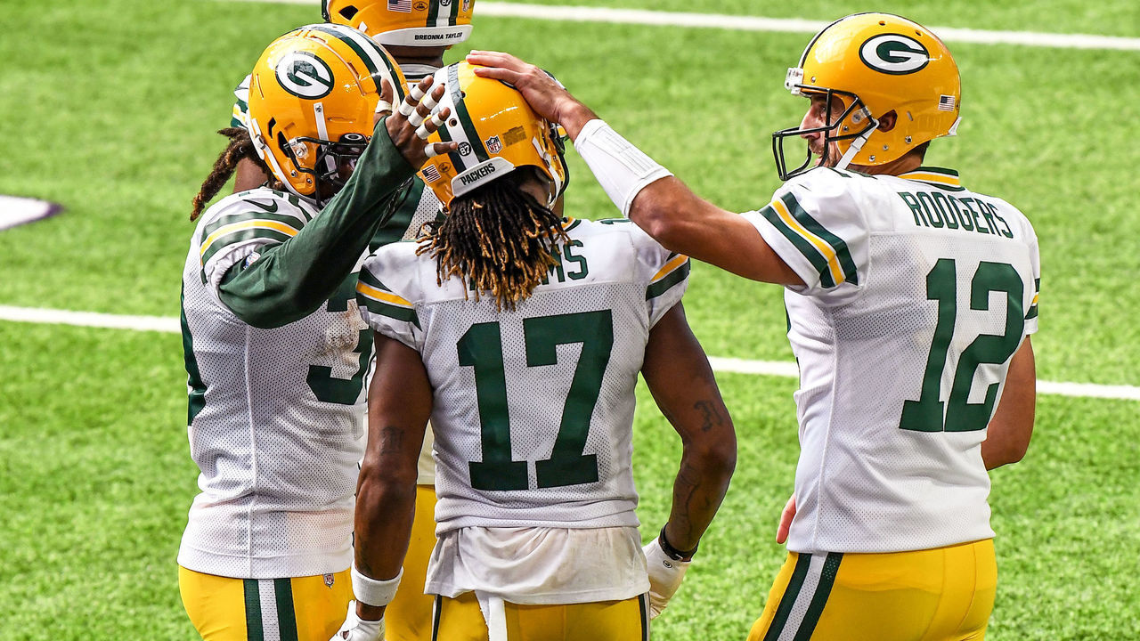 MINNEAPOLIS, MN - SEPTEMBER 13: Green Bay Packers Wide Receiver Davante Adams (17) is congratulated on his 3rd quarter 1-yard touchdown reception by Green Bay Packers Quarterback Aaron Rodgers (12) and Green Bay Packers Running Back Aaron Jones (33) during a National Football League game between the Minnesota Vikings and Green Bay Packers on September 13, 2020, at US Bank Stadium, Minneapolis, MN.