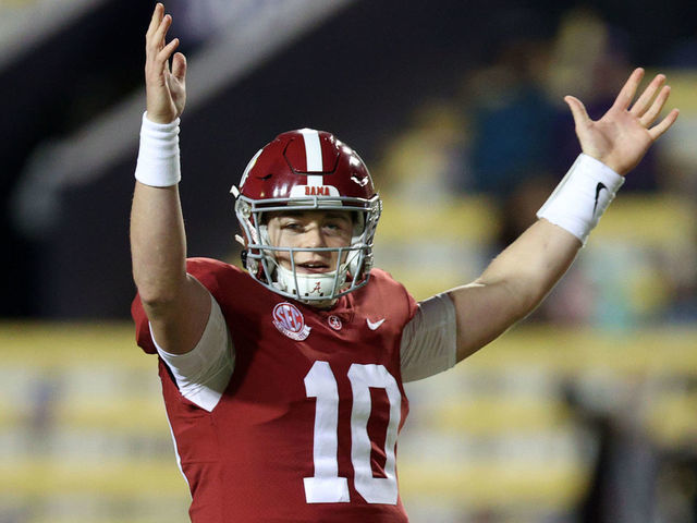 BATON ROUGE, LOUISIANA - DECEMBER 05: Mac Jones #10 of the Alabama Crimson Tide reacts after a touchdown against the LSU Tigers at Tiger Stadium on December 05, 2020 in Baton Rouge, Louisiana.