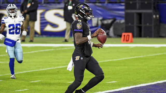 BALTIMORE, MD - DECEMBER 08: Baltimore Ravens quarterback Lamar Jackson (8) runs for a 37 yard touchdown in the first quarter during the Dallas Cowboys game versus the Baltimore Ravens on December 8, 2020 at M&T Bank Stadium in Baltimore, MD.