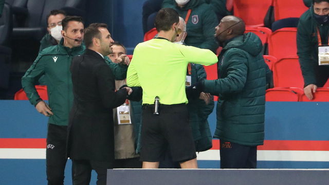 PARIS, FRANCE - DECEMBER 08: Pierre-Achille Webo of Istanbul talks with referee Ovidiu Alin Hategan during the confusion following an alleged incident between Istanbul Basaksehir assistant manager Pierre Achille Webo and the 4th official Sebastian Coltescu during the UEFA Champions League Group H stage match between Paris Saint-Germain and Istanbul Basaksehir at Parc des Princes on December 8, 2020 in Paris, France.