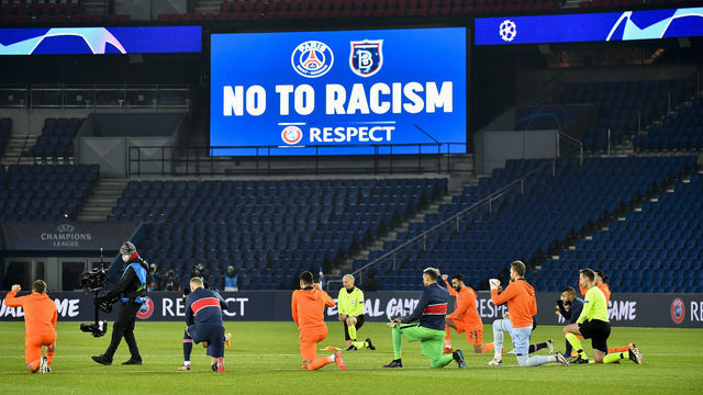 PARIS, FRANCE - DECEMBER 09: Players of Paris Saint Germain and Medipol Basaksehir kneal to stage a protest against racism ahead of the UEFA Champions League match between Paris Saint Germain and Medipol Basaksehir at Parc des Princes in Paris, France on December 09, 2020.