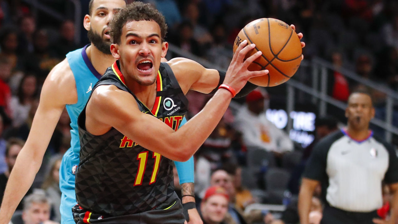 ATLANTA, GA - MARCH 09: Trae Young #11 of the Atlanta Hawks controls the ball in overtime of an NBA game against the Charlotte Hornets at State Farm Arena on March 9, 2020 in Atlanta, Georgia. NOTE TO USER: User expressly acknowledges and agrees that, by downloading and/or using this photograph, user is consenting to the terms and conditions of the Getty Images License Agreement.