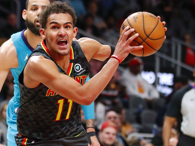ATLANTA, GA - MARCH 09: Trae Young #11 of the Atlanta Hawks controls the ball in overtime of an NBA game against the Charlotte Hornets at State Farm Arena on March 9, 2020 in Atlanta, Georgia. NOTE TO USER: User expressly acknowledges and agrees that, by downloading and/or using this photograph, user is consenting to the terms and conditions of the Getty Images License Agreement.