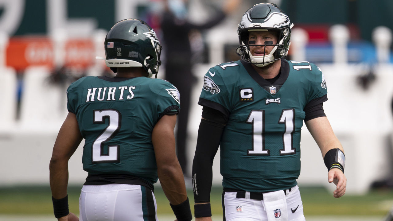 PHILADELPHIA, PA - SEPTEMBER 27: Jalen Hurts #2 and Carson Wentz #11 of the Philadelphia Eagles look on prior to the game against the Cincinnati Bengals at Lincoln Financial Field on September 27, 2020 in Philadelphia, Pennsylvania.