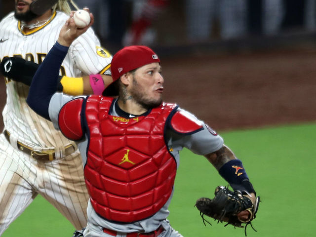 SAN DIEGO, CA - OCTOBER 02: Yadier Molina #4 of the St. Louis Cardinals turns a double play in the seventh inning during Game 3 of the Wild Card Series between the St. Louis Cardinals and the San Diego Padres at Petco Park on Friday, October 2, 2020 in San Diego, California.