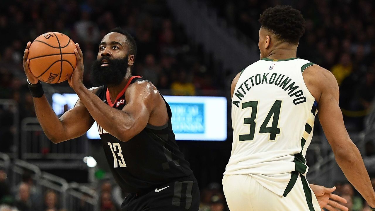 MILWAUKEE, WISCONSIN - MARCH 26: James Harden #13 of the Houston Rockets is defended by Giannis Antetokounmpo #34 of the Milwaukee Bucks during a game at Fiserv Forum on March 26, 2019 in Milwaukee, Wisconsin.