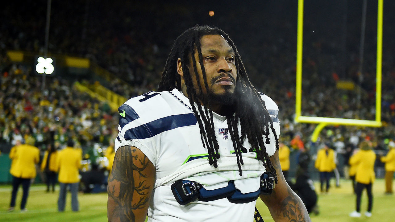 GREEN BAY, WISCONSIN - JANUARY 12: Marshawn Lynch #24 of the Seattle Seahawks looks on before the NFC Divisional Playoff game against the Green Bay Packers at Lambeau Field on January 12, 2020 in Green Bay, Wisconsin.