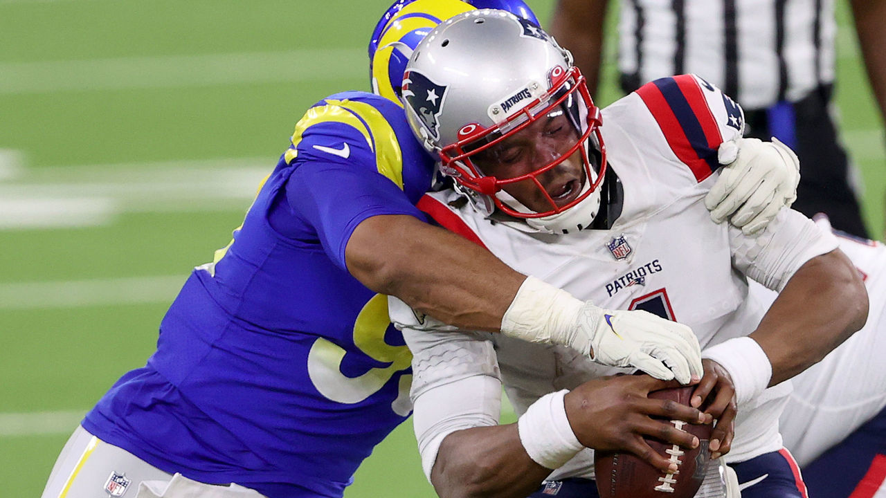 INGLEWOOD, CALIFORNIA - DECEMBER 10: Cam Newton #1 of the New England Patriots is sacked by Aaron Donald #99 of the Los Angeles Rams during the third quarter in the game at SoFi Stadium on December 10, 2020 in Inglewood, California.