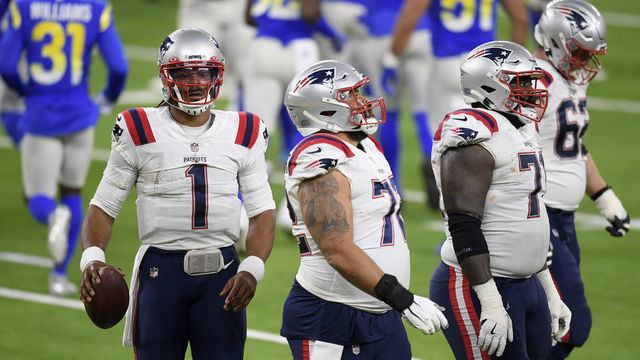INGLEWOOD, CALIFORNIA - DECEMBER 10: Cam Newton #1 of the New England Patriots walks off the field with teammates after being stopped on fourth down d2q in the game against the Los Angeles Rams at SoFi Stadium on December 10, 2020 in Inglewood, California.