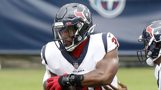 NASHVILLE, TENNESSEE - OCTOBER 18: Running back David Johnson #31 of the Houston Texans takes the hand off from quarterback Deshaun Watson #4 in the first quarter against the Tennessee Titans at Nissan Stadium on October 18, 2020 in Nashville, Tennessee.