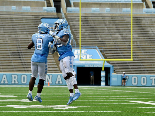 Michael Carter, Javonte Williams combine to set NCAA rushing record in  UNC's blowout of Miami