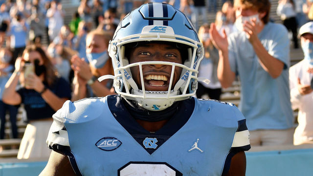 CHAPEL HILL, NORTH CAROLINA - NOVEMBER 14: Michael Carter #8 of the North Carolina Tar Heels reacts after scoring a touchdown against the Wake Forest Demon Deacons during the fourth quarter of their game at Kenan Stadium on November 14, 2020 in Chapel Hill, North Carolina. The Tar Heels won 59-53.