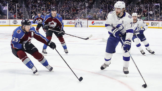 DENVER, CO - FEBRUARY 17: Tampa Bay Lightning defenseman Victor Hedman (77) looks to pass as Colorado Avalanche center Nathan MacKinnon (29) defends during the Tampa Bay Lightning and Colorado Avalanche NHL game on February 17, 2020, at Pepsi Center in Denver, CO.