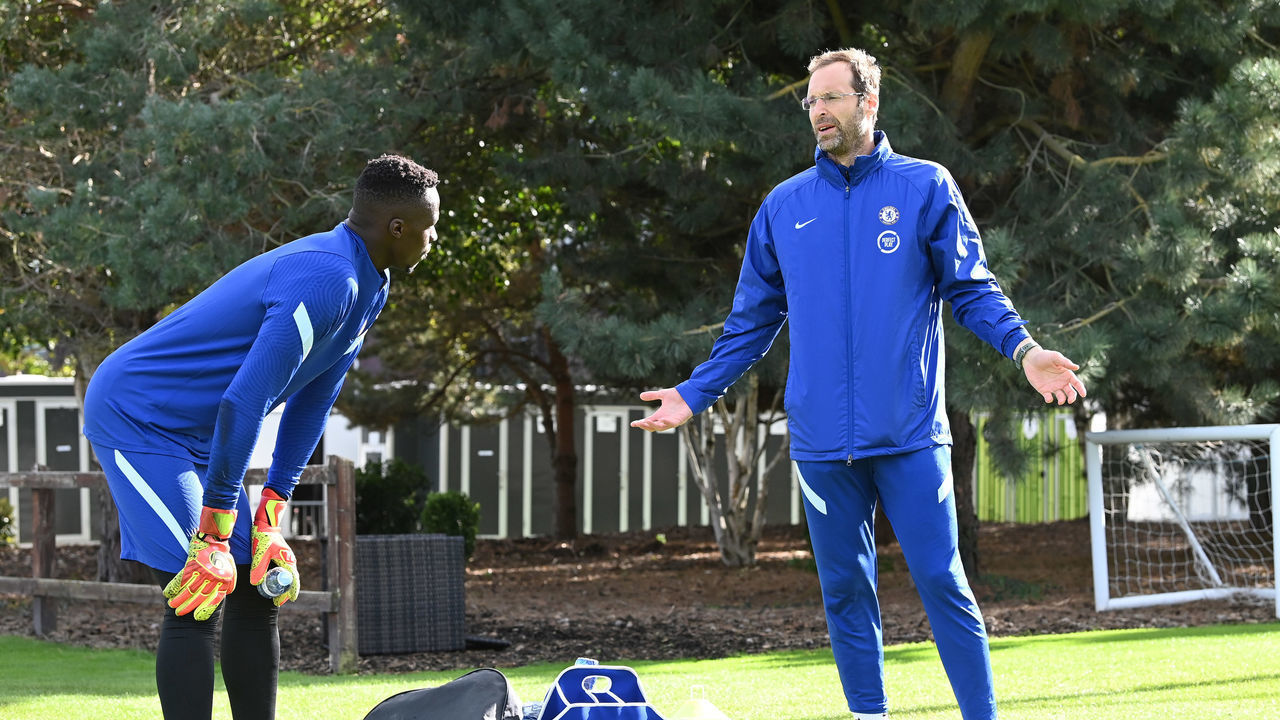 COBHAM, ENGLAND - SEPTEMBER 25: Petr Cech of Chelsea talks to Edouard Mendy of Chelsea during an individual training session at Chelsea Training Ground on September 25, 2020 in Cobham, England.