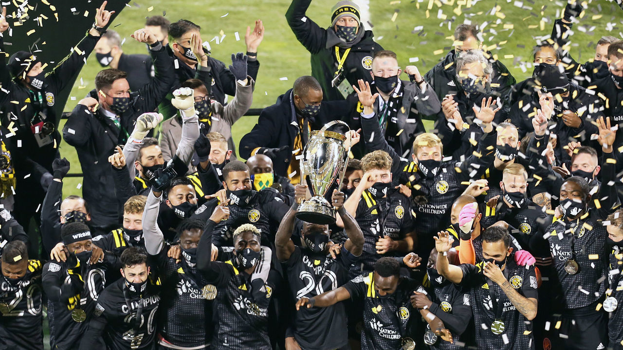COLUMBUS, OH - DECEMBER 12: Captain Jonathan Mensah #4 of Columbus Crew holds the trophy and celebrates with his teammates after winning the MLS Cup 2020 against the Seattle Sounders at MAPFRE Stadium on December 12, 2020 in Columbus, Ohio.