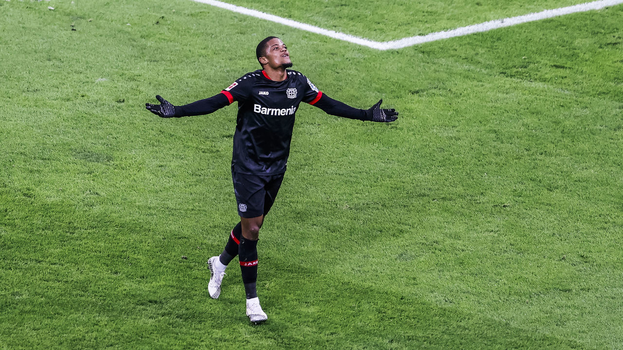 LEVERKUSEN, GERMANY - DECEMBER 13: Leon Bailey of Leverkusen celebrates scoring the 2:0 against goalkeeper Oliver Baumann of Hoffenheim during the Bundesliga match between Bayer 04 Leverkusen and TSG Hoffenheim at BayArena on December 13, 2020 in Leverkusen, Germany.