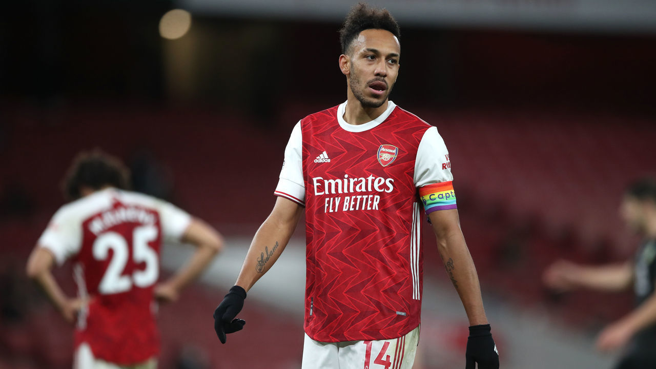 Arsenal's Pierre-Emerick Aubameyang (14) and Mohamed Elneny (left) dejected after the Premier League match at Emirates Stadium, London.