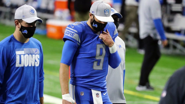 DETROIT, MICHIGAN - DECEMBER 13: Matthew Stafford #9 of the Detroit Lions walks off the field after being defeated by the Green Bay Packers 31-24 at Ford Field on December 13, 2020 in Detroit, Michigan.