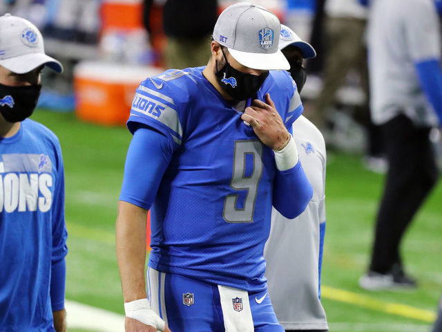 DETROIT, MICHIGAN - DECEMBER 13: Matthew Stafford #9 of the Detroit Lions walks off the field after being defeated by the Green Bay Packers 31-24 at Ford Field on December 13, 2020 in Detroit, Michigan.