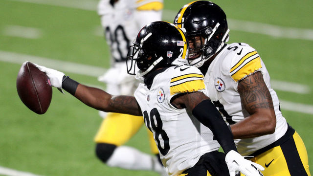 ORCHARD PARK, NEW YORK - DECEMBER 13: Mike Hilton #28 of the Pittsburgh Steelers celebrates his interception with Avery Williamson #51 against the Buffalo Bills during the first quarter in the game at Bills Stadium on December 13, 2020 in Orchard Park, New York.