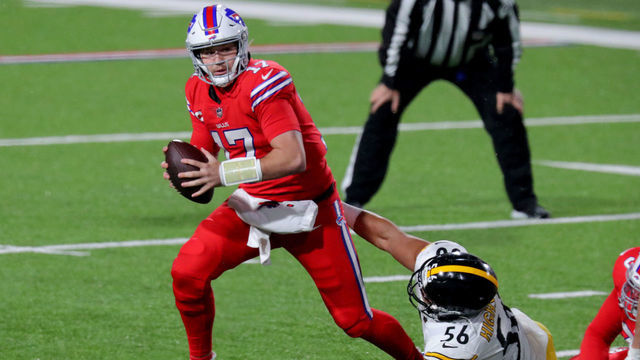 ORCHARD PARK, NEW YORK - DECEMBER 13: Josh Allen #17 of the Buffalo Bills looks to pass while pressured by Alex Highsmith #56 of the Pittsburgh Steelers during the first quarter in the game at Bills Stadium on December 13, 2020 in Orchard Park, New York.