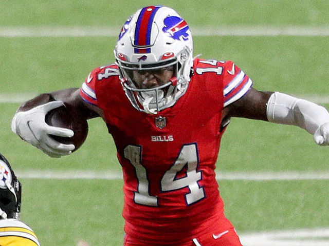 ORCHARD PARK, NEW YORK - DECEMBER 13: Stefon Diggs #14 of the Buffalo Bills eludes Minkah Fitzpatrick #39 and Sean Davis #21 of the Pittsburgh Steelers during the third quarter in the game at Bills Stadium on December 13, 2020 in Orchard Park, New York.