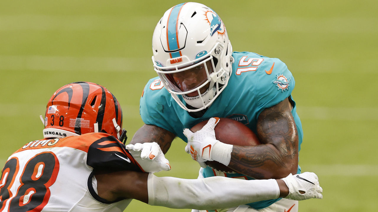 MIAMI GARDENS, FLORIDA - DECEMBER 06: Wide receiver Lynn Bowden Jr. #15 of the Miami Dolphins runs with the ball against cornerback LeShaun Sims #38 of the Cincinnati Bengals in the third quarter of the game at Hard Rock Stadium on December 06, 2020 in Miami Gardens, Florida.