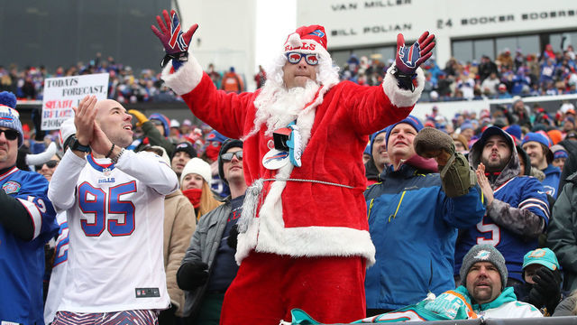 BUFFALO, NY - DECEMBER 17: A fan dressed up as Santa Claus celebrates a touchdown from the front row during the Buffalo Bills NFL game against the Miami Dolphins at New Era Field on December 17, 2017 in Buffalo, New York.