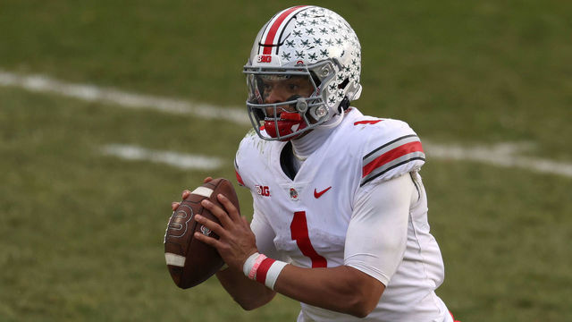 EAST LANSING, MICHIGAN - DECEMBER 05: Justin Fields #1 of the Ohio State Buckeyes looks to pass in the second half against the Michigan State Spartans at Spartan Stadium on December 05, 2020 in East Lansing, Michigan. Ohio State won the game 52-12.