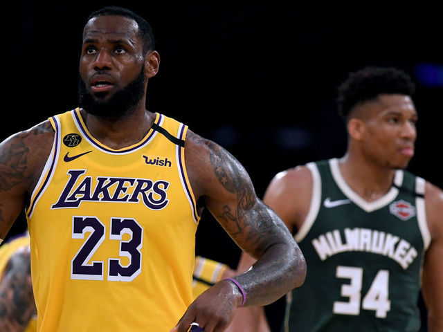 LOS ANGELES, CALIFORNIA - MARCH 06: LeBron James #23 of the Los Angeles Lakers reacts after his basket in front of Giannis Antetokounmpo #34 of the Milwaukee Bucks at Staples Center on March 06, 2020 in Los Angeles, California.