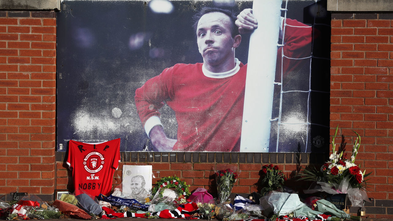 Tributes outside Old Trafford before the service and committal of former Manchester United player Nobby Stiles takes place later.