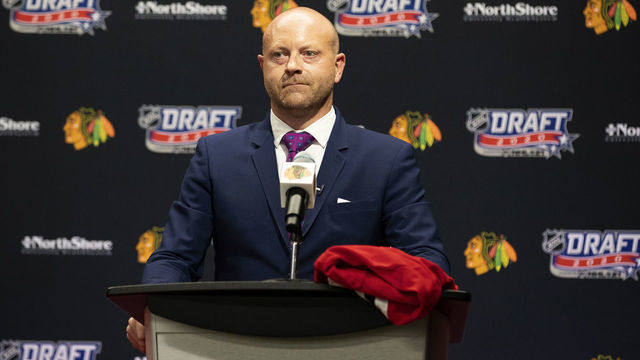 CHICAGO, ILLINOIS - OCTOBER 06: Vice president and general manager Stan Bowman of the Chicago Blackhawks speaks from the podium before their 17th overall pick in the first round of the 2020 NHL Entry Draft at Fifth Third Arena on October 06, 2020 in Chicago, Illinois. The 2020 NHL Draft was held virtually due to the ongoing Coronavirus pandemic.