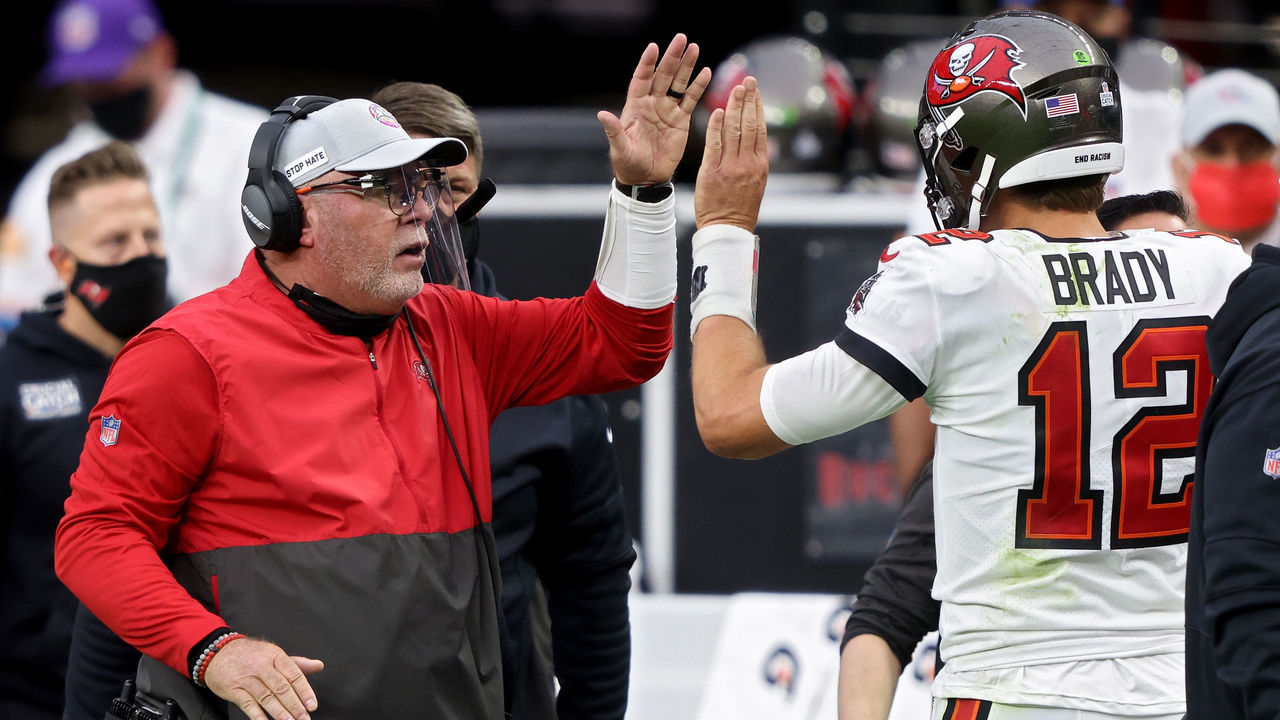 LAS VEGAS, NEVADA - OCTOBER 25: Head coach Bruce Arians and Tom Brady #12 of the Tampa Bay Buccaneers celebrate after scoring a touchdown in the second quarter against the Las Vegas Raiders at Allegiant Stadium on October 25, 2020 in Las Vegas, Nevada.