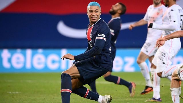 Paris Saint-Germain's French forward Kylian Mbappe reacts during the French L1 football match between Paris-Saint Germain (PSG) and FC Lorient at The Parc des Princes Stadium in Paris on December 16, 2020.