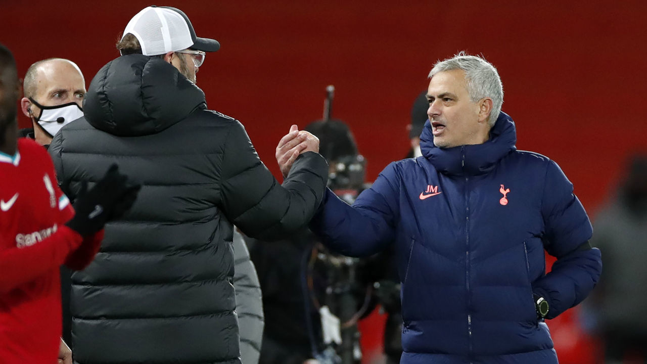 Liverpool's German manager Jurgen Klopp (2L) shakes hands with Tottenham Hotspur's Portuguese head coach Jose Mourinho following the English Premier League football match between Liverpool and Tottenham Hotspur at Anfield in Liverpool, north west England on December 16, 2020. - Liverpool won the match 2-1.