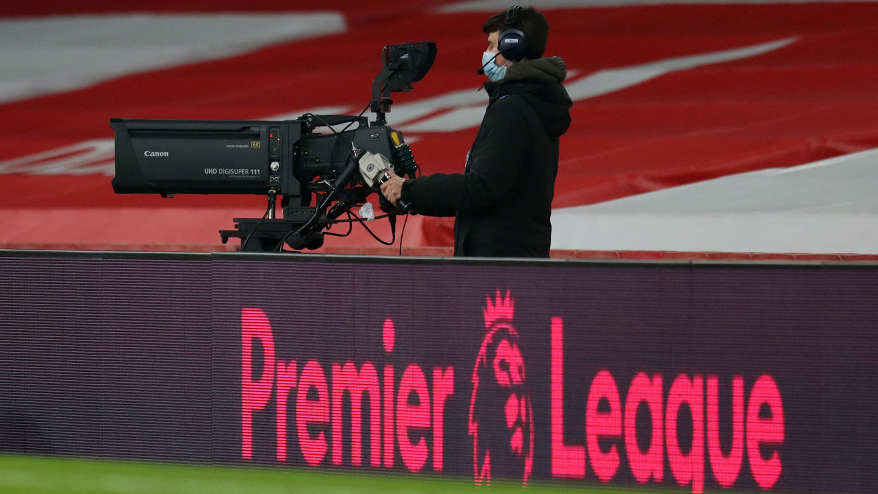 LONDON, ENGLAND - NOVEMBER 29: A television camera behind the Premier League logo during the Premier League match between Arsenal and Wolverhampton Wanderers at Emirates Stadium on November 29, 2020 in London, England. Sporting stadiums around the UK remain under strict restrictions due to the Coronavirus Pandemic as Government social distancing laws prohibit fans inside venues resulting in games being played behind closed doors.