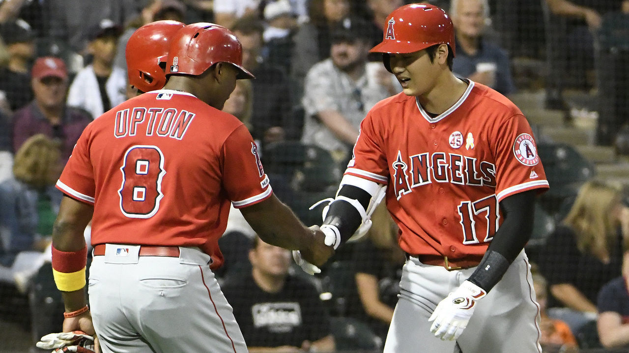 CHICAGO, ILLINOIS - SEPTEMBER 07: Shohei Ohtani #17 of the Los Angeles Angels of Anaheim is greeted by Justin Upton #8 after hitting a three-run home run against the Chicago White Sox during the third inning at Guaranteed Rate Field on September 07, 2019 in Chicago, Illinois.