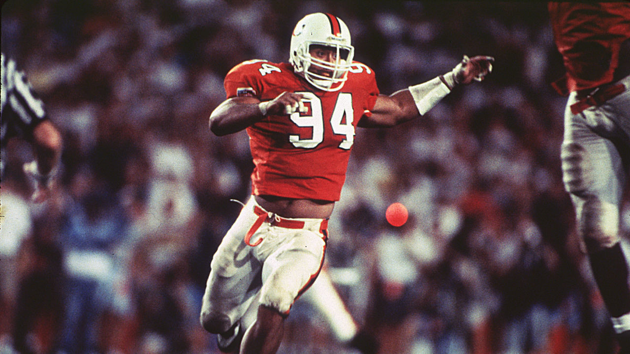 MIAMI - CIRCA 1992-94: Dwayne Johnson (The Rock) #94 of the University of Miami Hurricanes runs upfield to make the stop at the Orange Bowl in Miami, Florida. (Photos by Miami/Collegiate Images via Getty Images)
