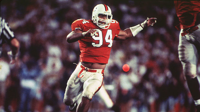 MIAMI - CIRCA 1992-94: Dwayne Johnson (The Rock) #94 of the University of Miami Hurricanes runs upfield to make the stop at the Orange Bowl in Miami, Florida. (Photos by Miami/Collegiate Images via Getty Images)