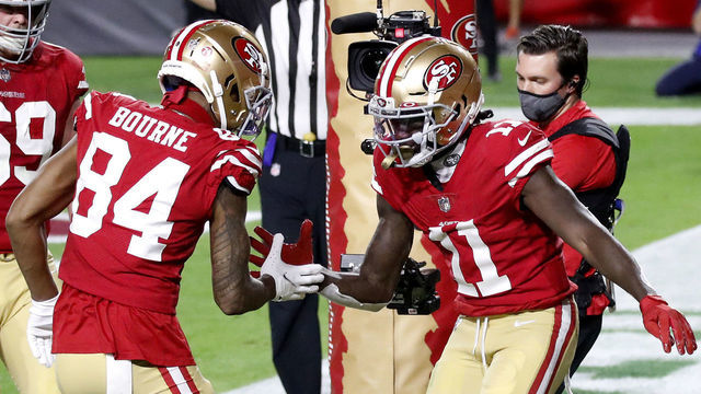 GLENDALE, ARIZONA - DECEMBER 07: Wide receiver Brandon Aiyuk #11 of the San Francisco 49ers celebrates a two-yard reception for a touchdown alongside Kendrick Bourne #84 during the first quarter of a game against the Buffalo Bills at State Farm Stadium on December 07, 2020 in Glendale, Arizona.