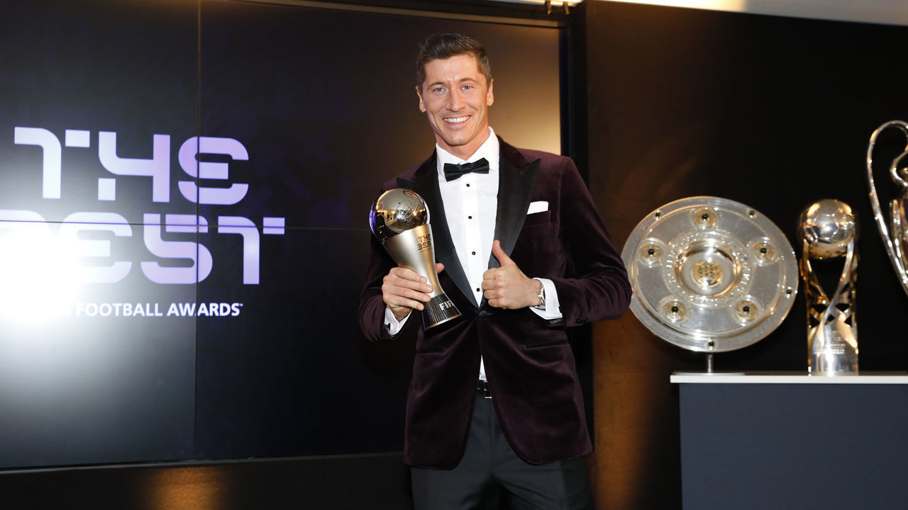 MUNICH, GERMANY - DECEMBER 17: Robert Lewandowski of FC Bayern Muenchen poses after winning the FIFA Men's Player 2020 trophy during the FIFA The BEST Awards ceremony on December 17, 2020 in Munich, Germany.