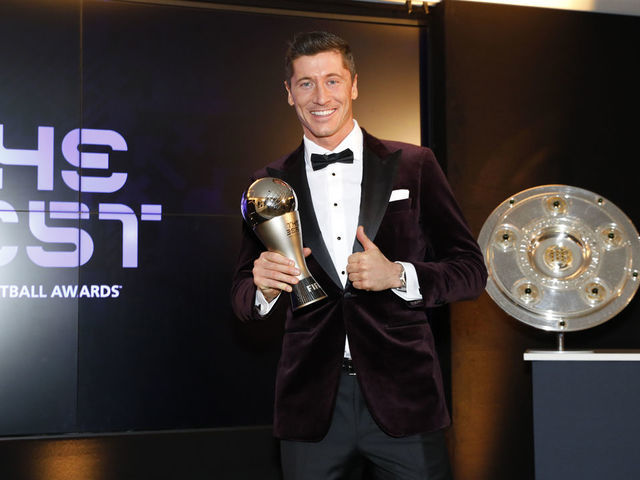 MUNICH, GERMANY - DECEMBER 17: Robert Lewandowski of FC Bayern Muenchen poses after winning the FIFA Men's Player 2020 trophy during the FIFA The BEST Awards ceremony on December 17, 2020 in Munich, Germany.