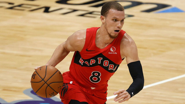 CHARLOTTE, NORTH CAROLINA - DECEMBER 14: Malachi Flynn #8 of the Toronto Raptors dribbles during the second quarter of their game against the Charlotte Hornets at Spectrum Center on December 14, 2020 in Charlotte, North Carolina.
