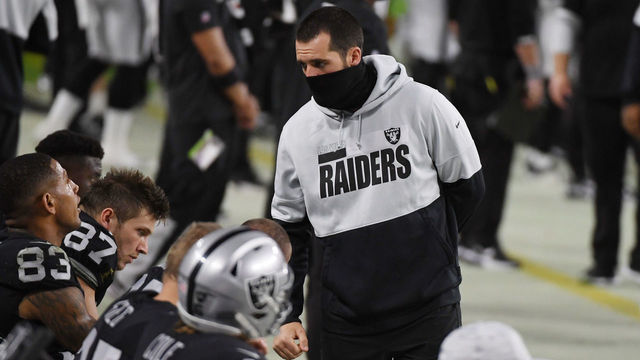 LAS VEGAS, NEVADA - DECEMBER 17: Quarterback Derek Carr #4 of the Las Vegas Raiders talks with players on the bench during the second half against the Los Angeles Chargers at Allegiant Stadium on December 17, 2020 in Las Vegas, Nevada.