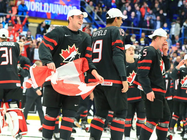 OSTRAVA, CZECH REPUBLIC - JANUARY 5, 2020: Canadian players Liam Foudy, Quinton Byfield, and Jacob Bernard-Docker (L-R front) celebrate with the trophy after the medal ceremony for the 2020 World Junior Ice Hockey Championship final match between Canada and Russia at Ostravar Arena; Canada won 4-3. Peter Kovalev/TASS