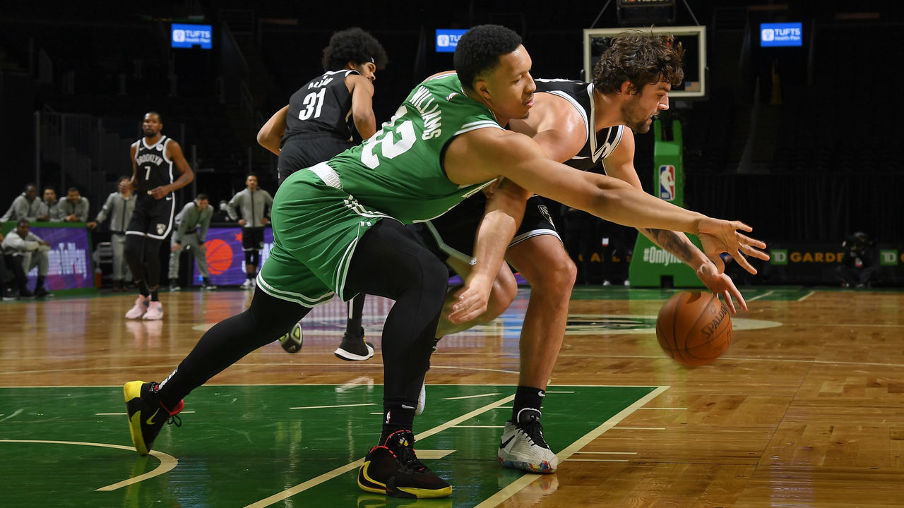 BOSTON, MA - DECEMBER 18: Grant Williams #12 of the Boston Celtics reaches for the ball against the Brooklyn Nets during a preseason game on December 18, 2020 at the TD Garden in Boston, Massachusetts. Mandatory Copyright Notice: Copyright 2020 NBAE