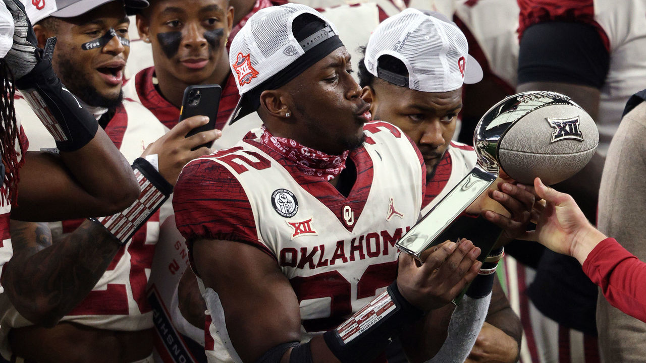 ARLINGTON, TEXAS - DECEMBER 19: Delarrin Turner-Yell #32 of the Oklahoma Sooners holds the Big 12 trophy after defeating the Iowa State Cyclones 27-21 in the 2020 Big 12 Championship at AT&T Stadium on December 19, 2020 in Arlington, Texas.