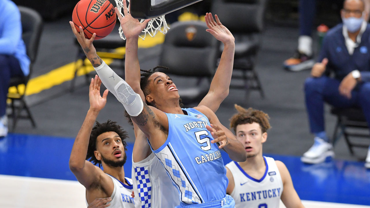 CLEVELAND, OHIO - DECEMBER 19: Armando Bacot #5 of the North Carolina Tar Heels shoots over Lance Ware #55 of the Kentucky Wildcats during the second half at Rocket Mortgage Fieldhouse on December 19, 2020 in Cleveland, Ohio.